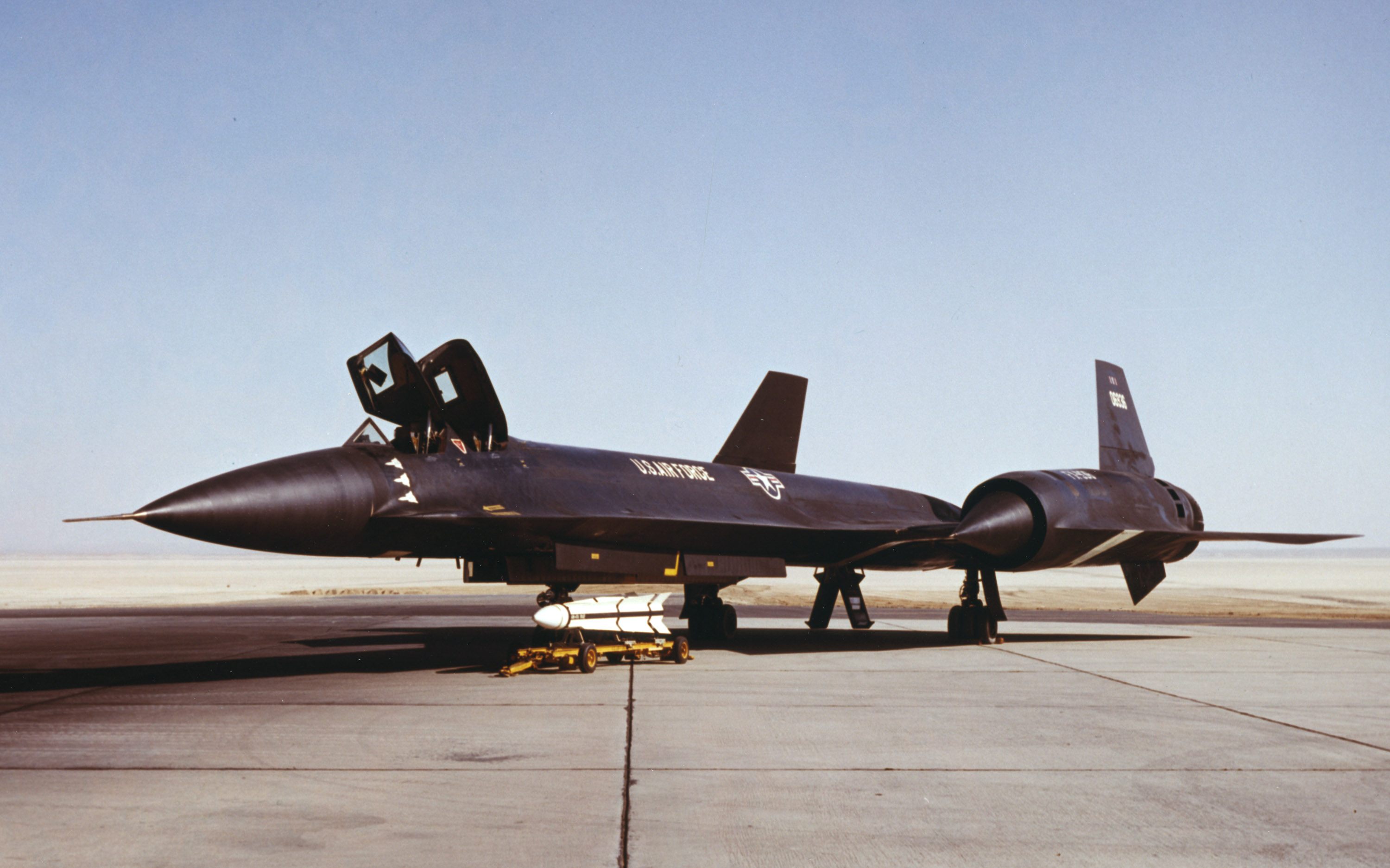 A Hughes AIM-47 missile sits next to the third Lockheed YF-12A Blackbird at Edwards AFB. The white silhouettes on the forward fuselage denote the speed and altitude records set in May 1965. (AFTC/HO photo)