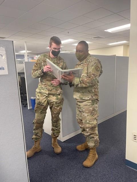 MSgt Issacs at work - looking at file folders